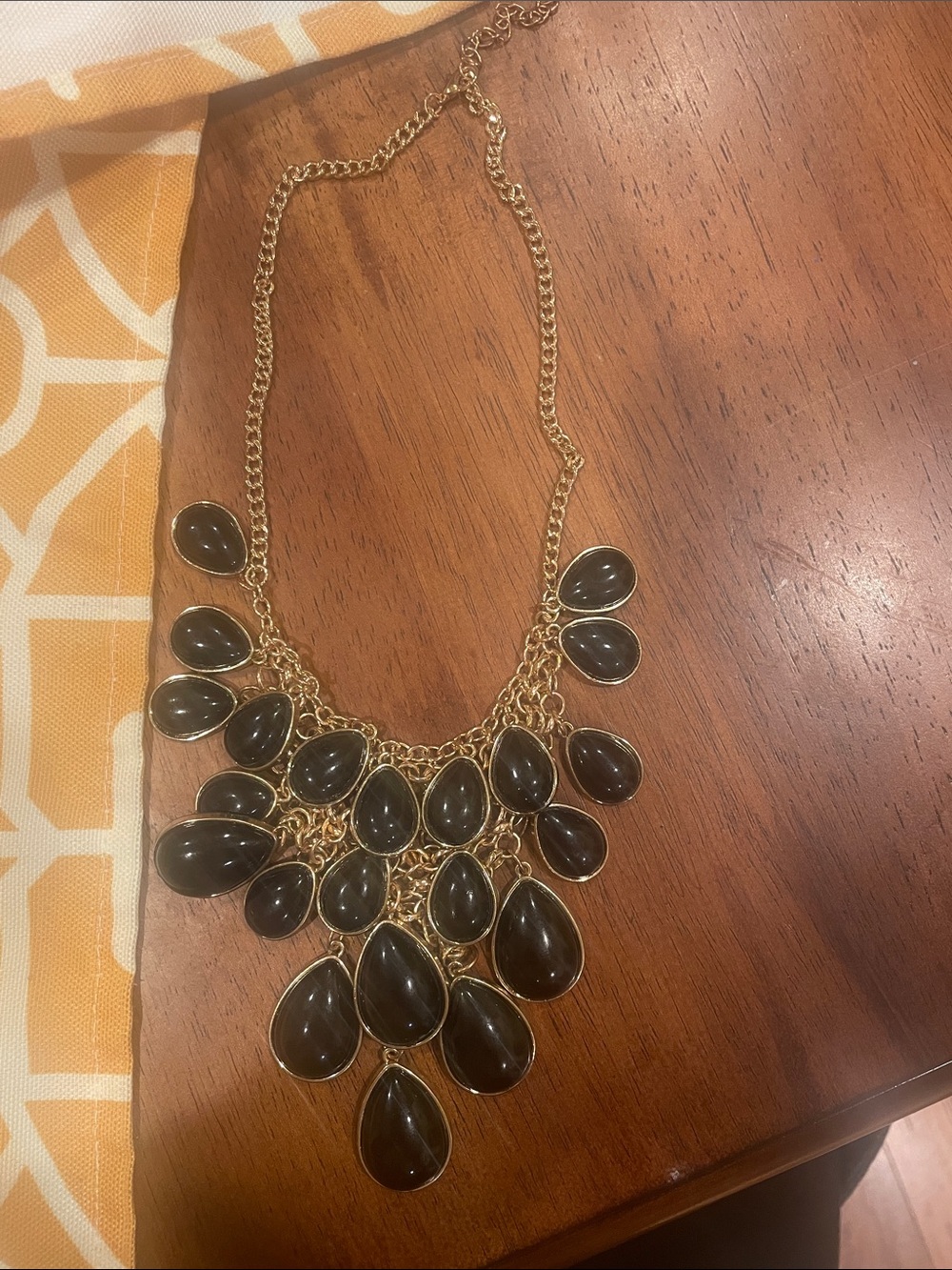 Gold Statement Bib Necklace with Black Teardrop Stones